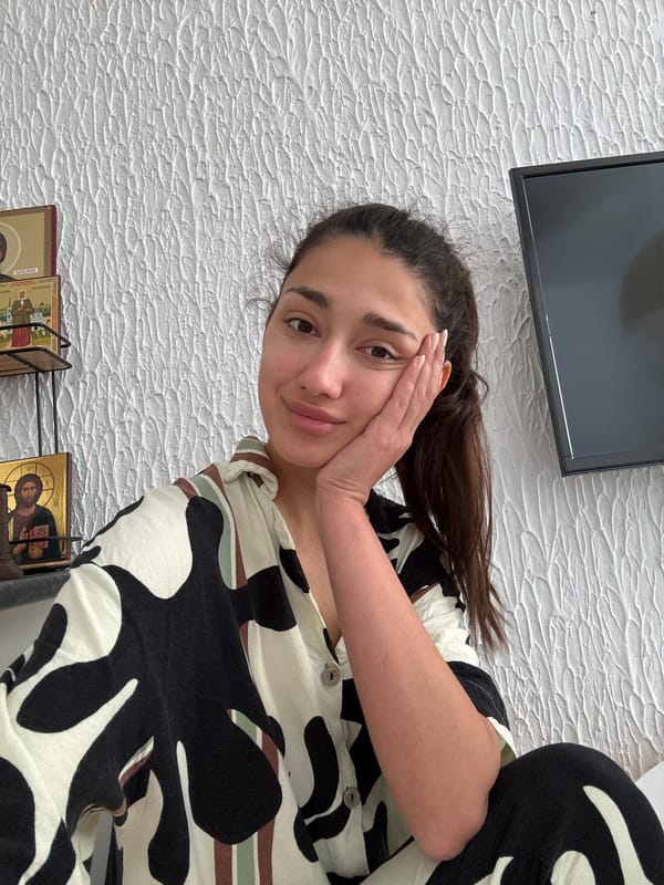 Woman rests pensively in Sutomore, Montenegro morning scene