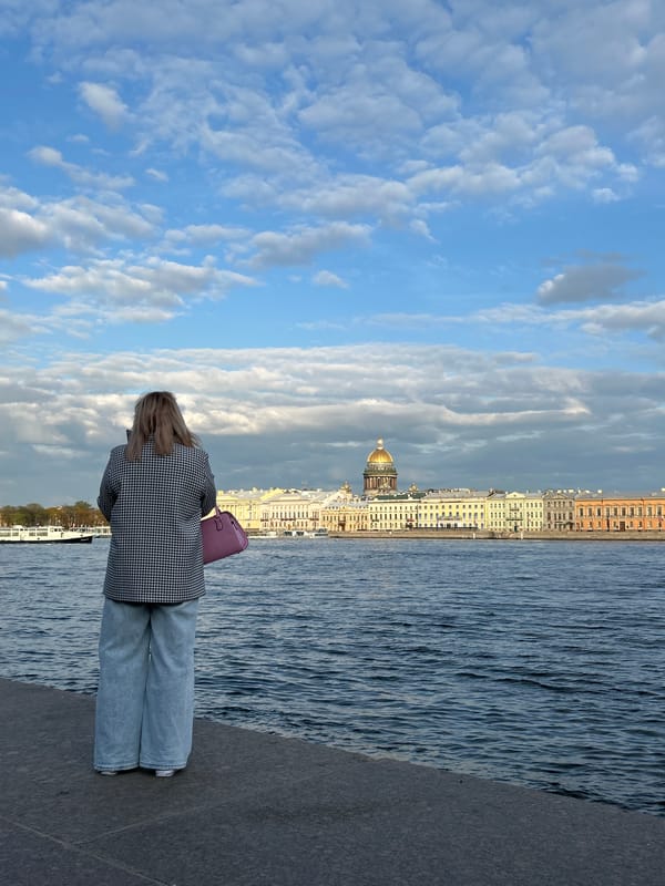 Woman observed standing on Neva River embankment in Saint Petersburg
