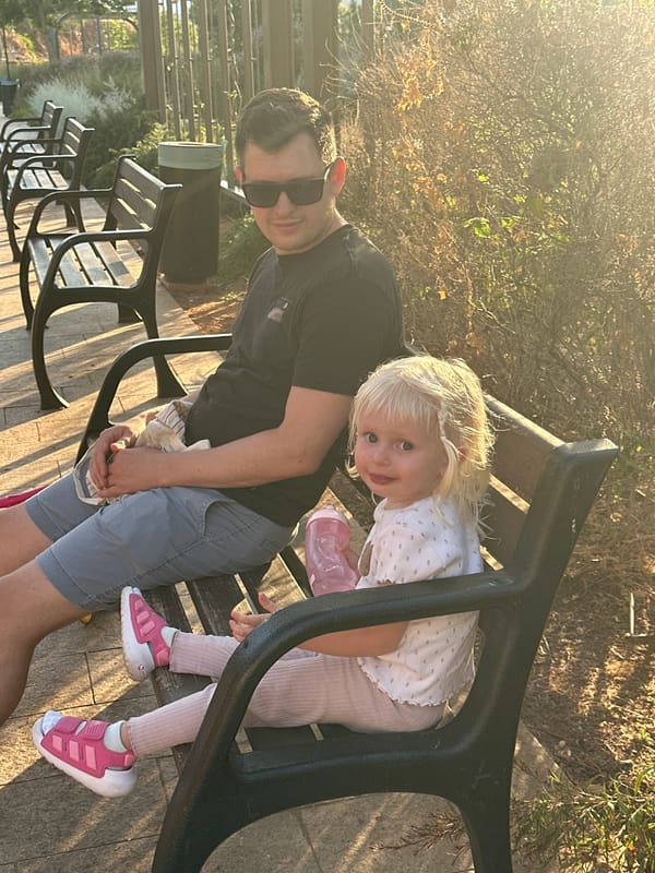 Afternoon at a Givat Shmuel park: koi pond, flowers, and play