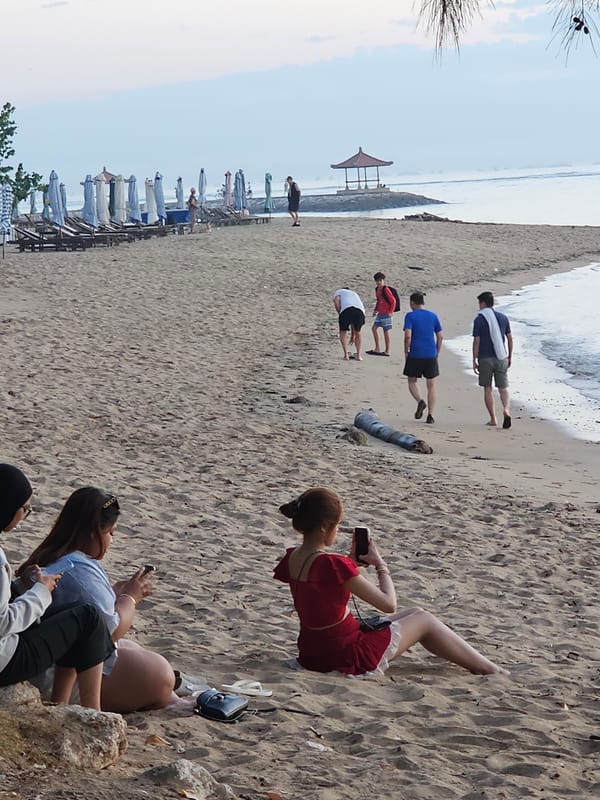 Evening beach life documented across Denpasar coastline