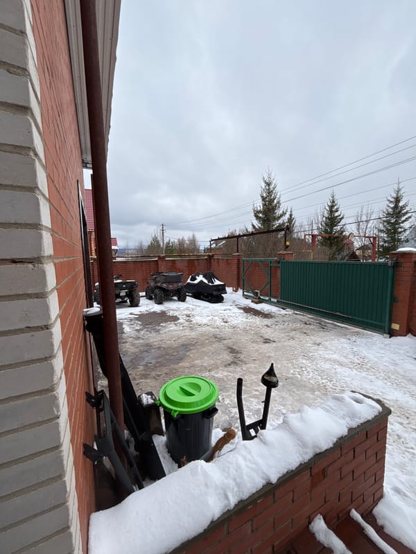 Woman photographed near ATV in snowy Russian village
