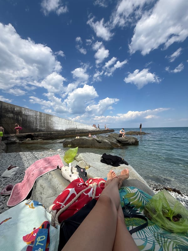 A relaxed summer day on the rocky shores of Partenit