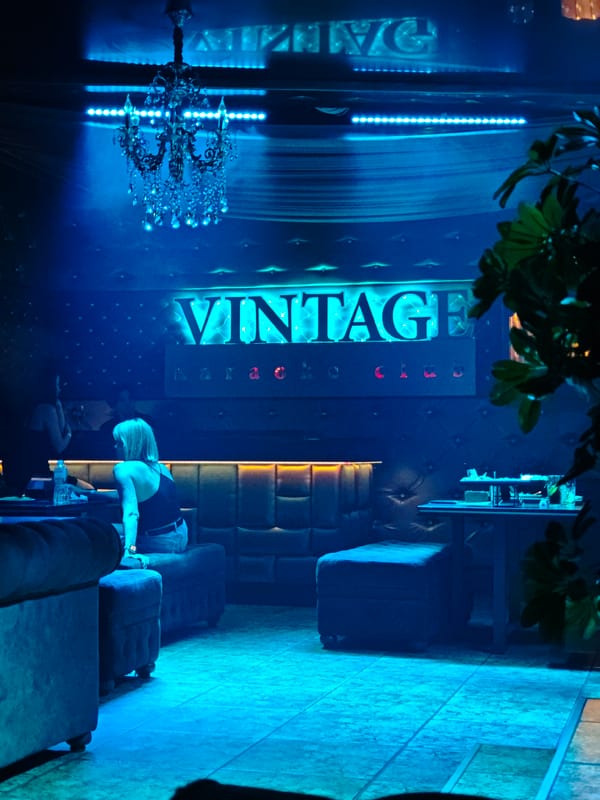 Inside Tiraspol's Vintage Karaoke Club, bathed in blue light