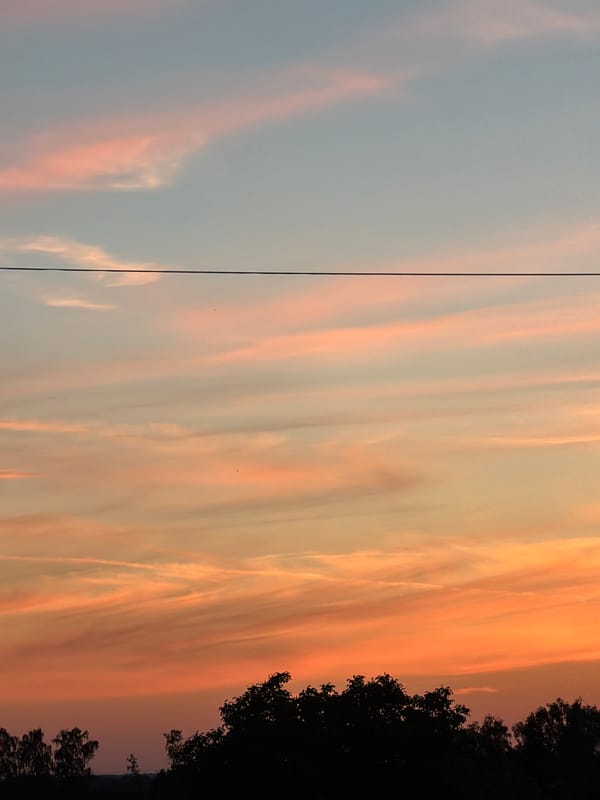 Summer sunset over Gorzów, watched from indoors and out