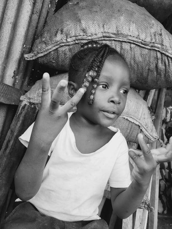 Child documented resting on metal surface in Bukuru, Nigeria