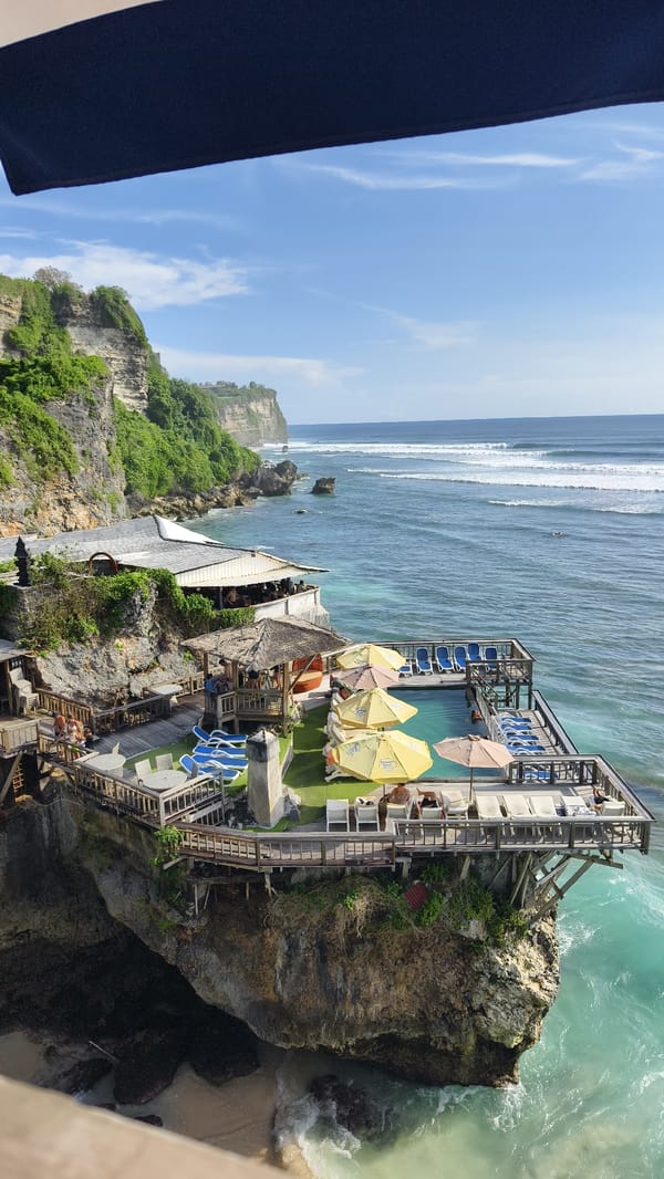 Cliffside resort with pool captured in Pecatu, Indonesia morning