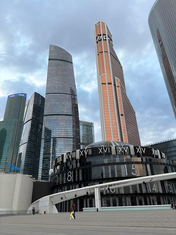 Modern skyscrapers and decorative clock photographed in Khimki, Russia