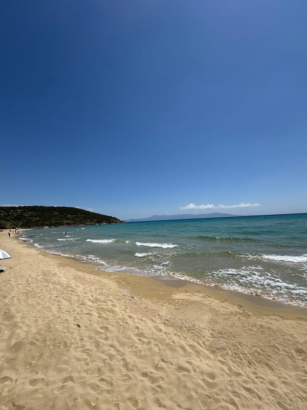 Beachgoer enjoys morning at Nea Peramos, Greece seaside