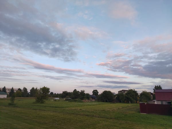 Rural dusk scene paired with a simple motivational quote
