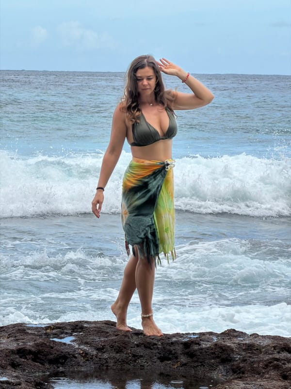 Woman poses at scenic Nusa Penida coastal locations