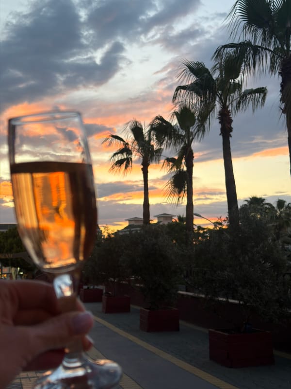 Resort guest captures sunset drinks and decorative lighting in Serik