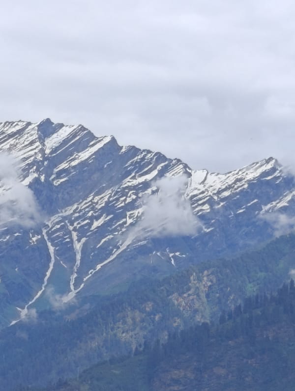 Snow-capped peaks and village life in Vashisht's mountain valley