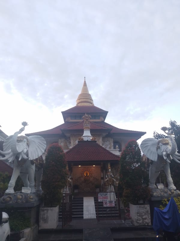 Tourist documents Balinese temples and cultural sites in Kuta Selatan