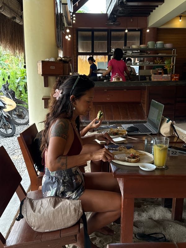 Woman dines with sleeping cat at General Luna restaurant