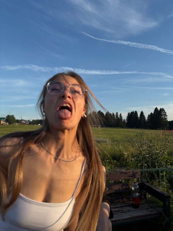 Summer afternoon at a rural playground and field in Фоки