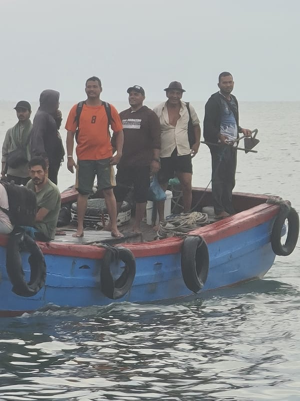 Evening fishing operations and market activity in Lhokseumawe, Indonesia