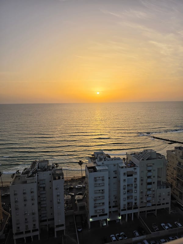 Beachgoers enjoy cloudy afternoon at Bat Yam, Israel coastline