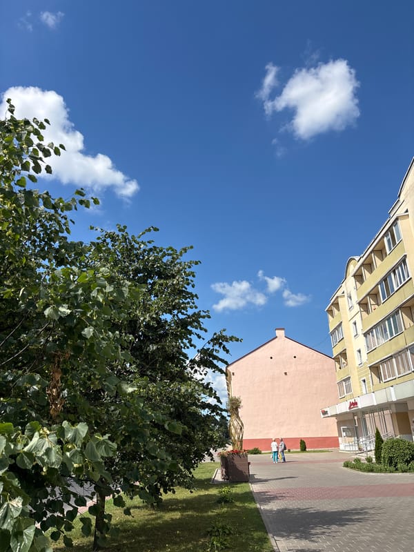 Street-level views of a Hrodna corner on a sunny morning