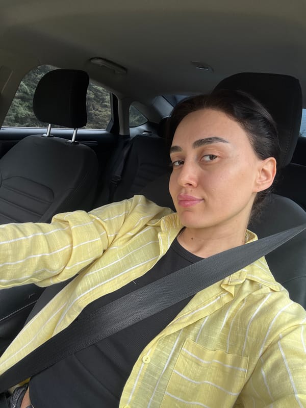 Woman takes selfie in car in Tbilisi