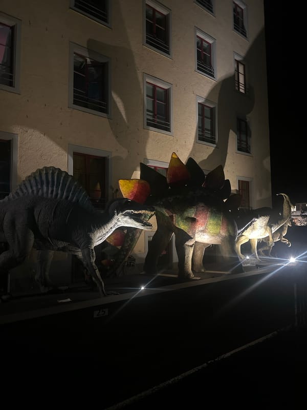 Illuminated dinosaur sculptures spotted on building in Sack, Switzerland