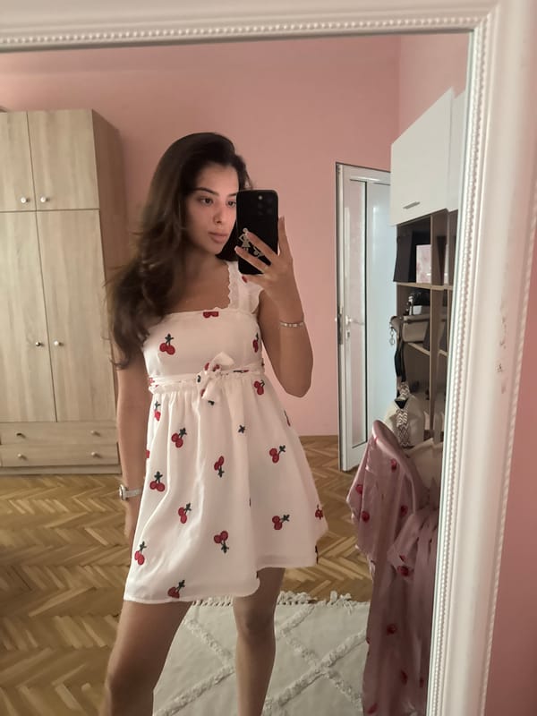 Sunny balcony selfies in a white cherry-print dress, Plovdiv