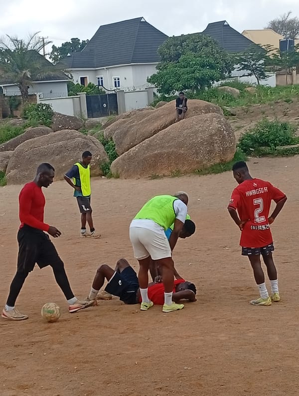 Morning scenes from a Jos neighborhood — rocks, kids, and street life