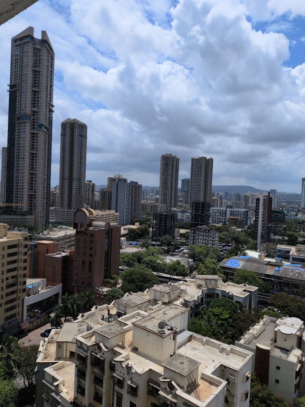 Mumbai rooftop views mixed with collectibles and figurines