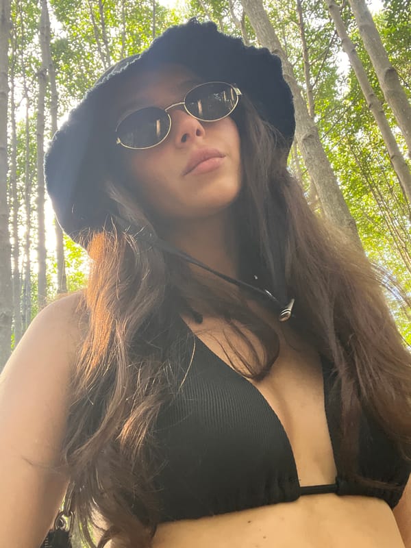 Woman photographed on elevated walkway through Phuket mangrove forest