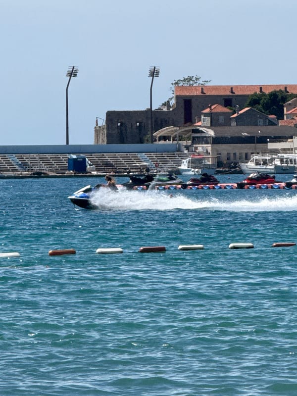Budva beach in full summer swing, on land and water