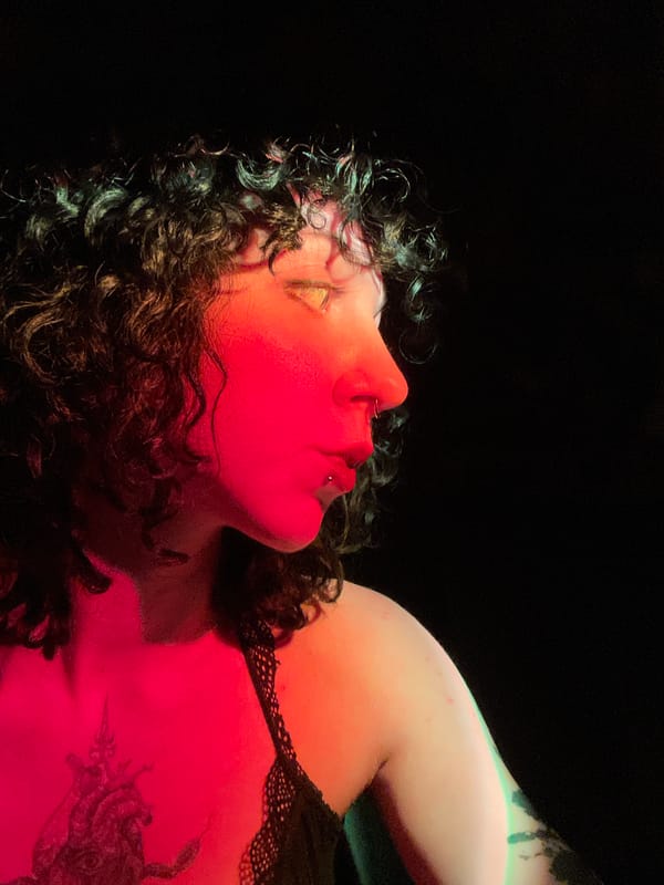 Portrait captured in dramatic red lighting in Belgrade suburb