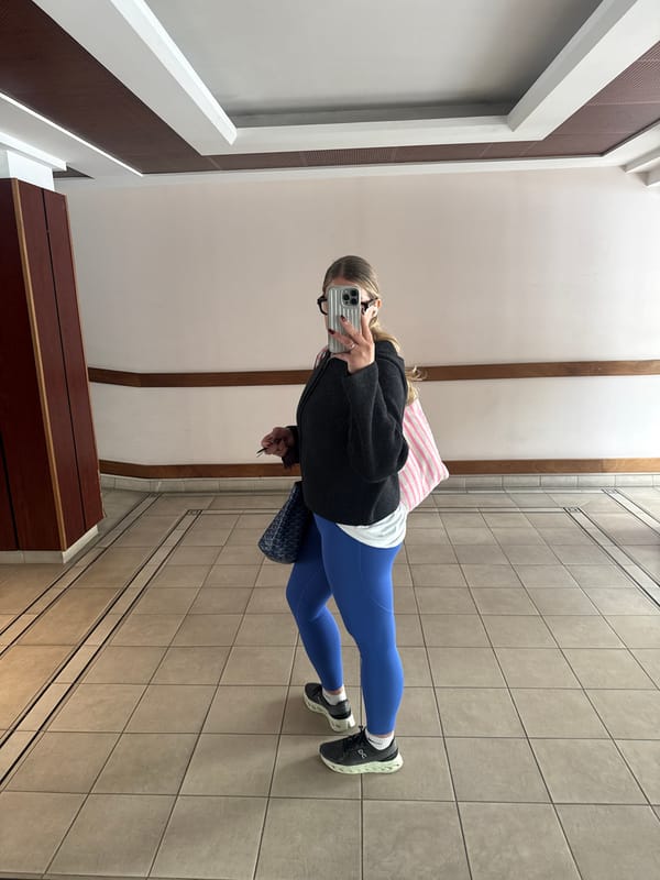 Person takes selfie in Paris building hallway