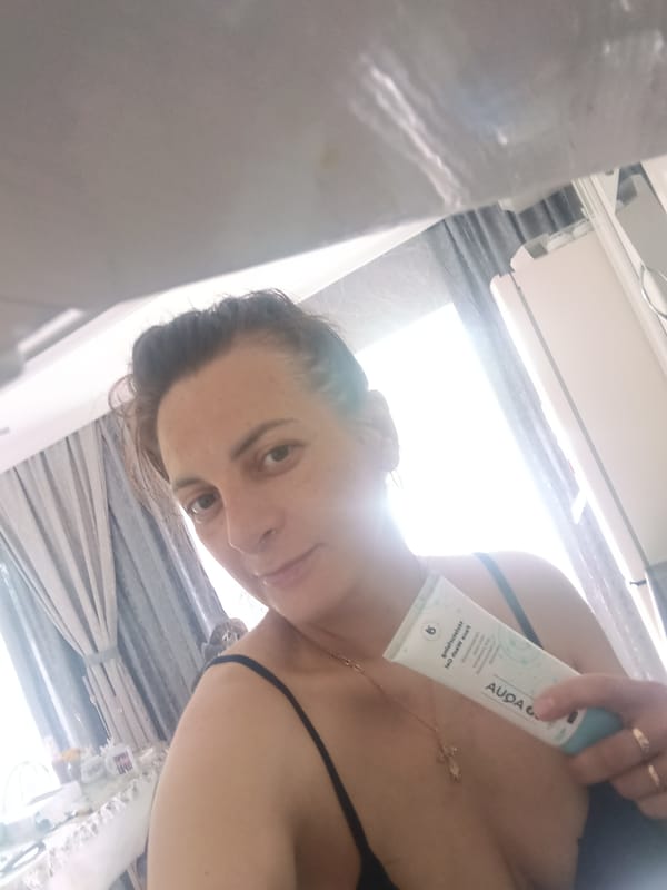 Woman poses with skincare product in Andreyevo, Russia