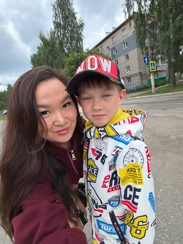 Outdoor selfie in Chaikovsky featuring a colorful racing-print jacket