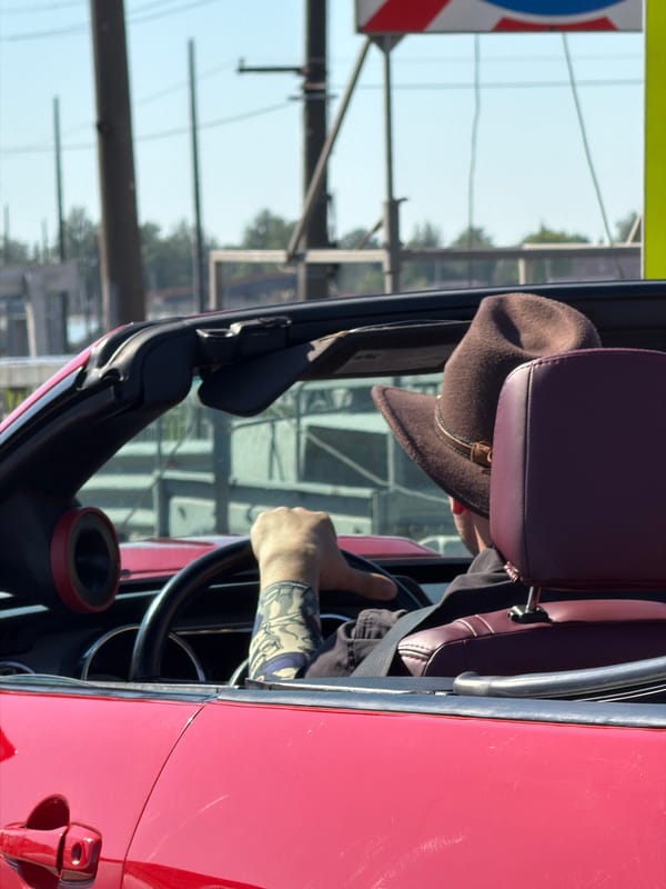 Tattooed driver spotted in red convertible, Saint Petersburg