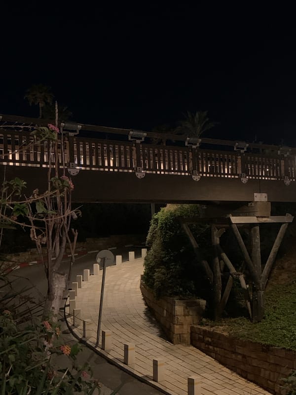 Nighttime architectural scenes captured across Tel Aviv public spaces