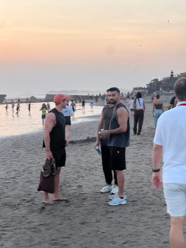 North Kuta beach at golden hour, crowds and surf