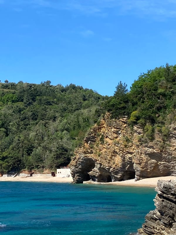 Woman photographed resting in coastal rock formation, Budva Montenegro