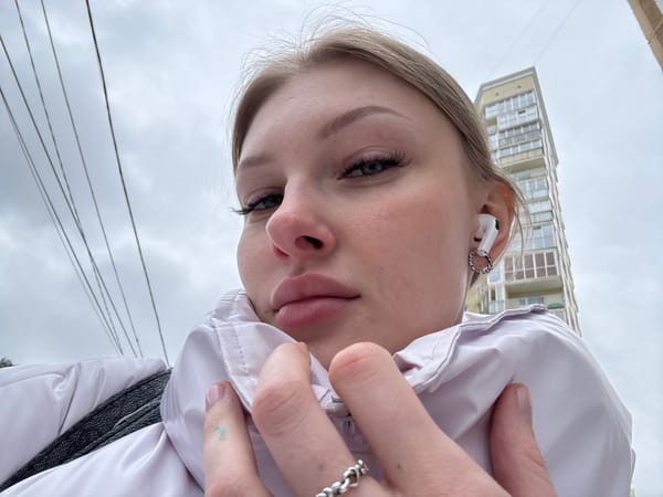 Woman takes selfies outdoors in Perm, Russia