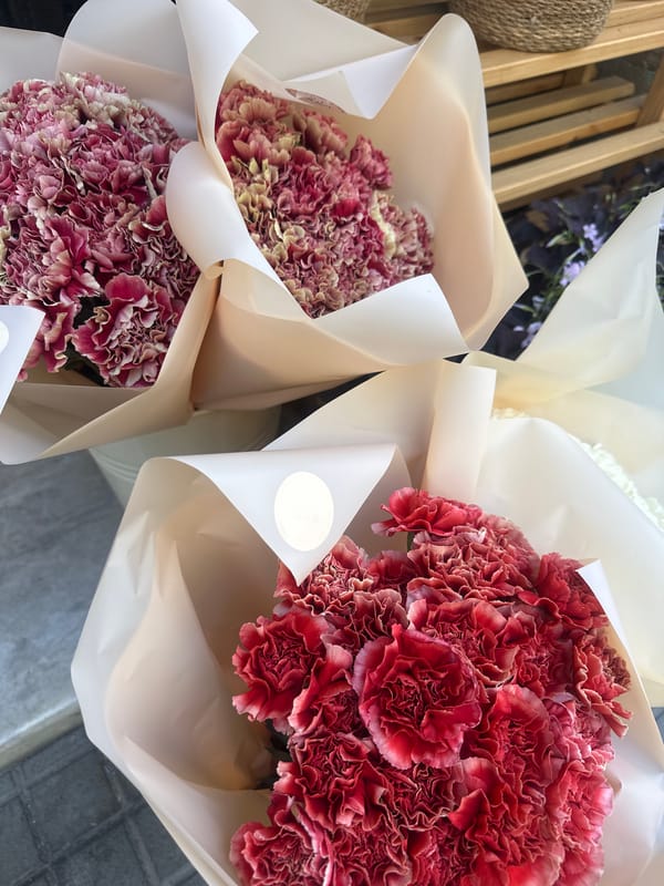 Flower stalls and street architecture on a sunny Barcelona afternoon