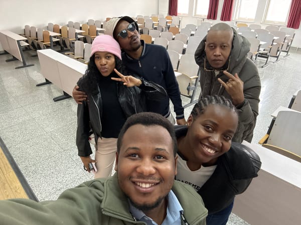 Four people take selfie in lecture hall, Daxing District