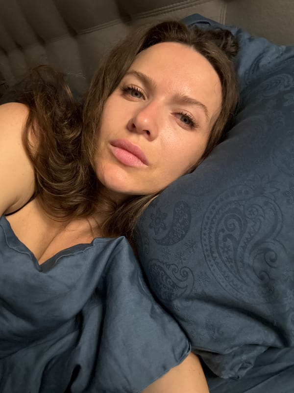 Woman rests on sofa in Khimki residence