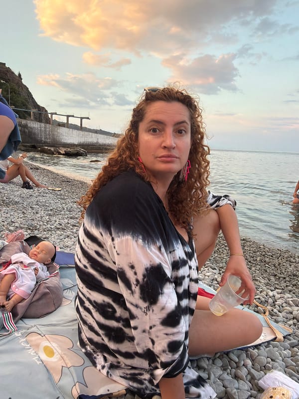 Lazy summer day at a Crimean beach and pier