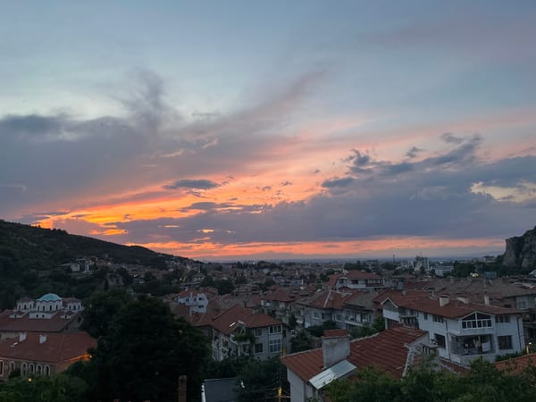Dramatic sunset captured over Asenovgrad, Bulgaria with Pomeranian dog