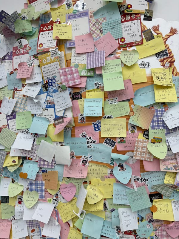 Sticky note wall and illuminated cafe documented in Zhongtun