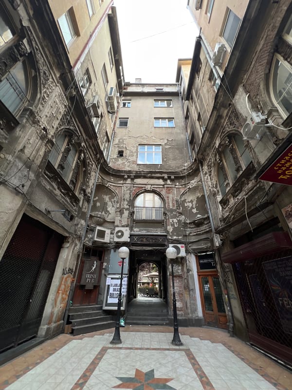 Evening dining scene captured in historic Belgrade courtyard