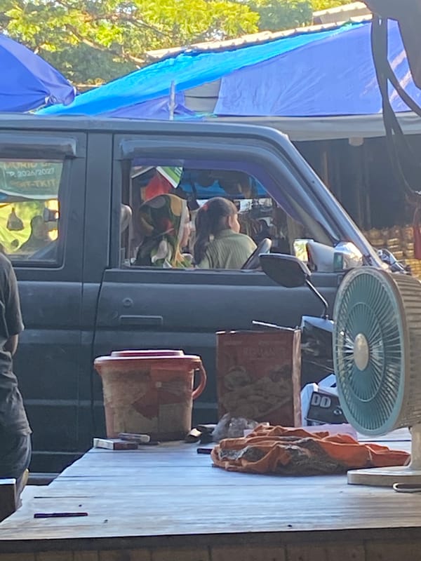 Market morning and family moments in Ta', Indonesia