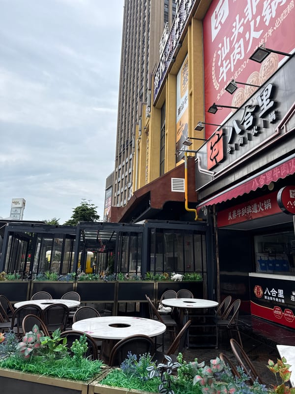 Street-level and balcony views across a cloudy Haizhu neighborhood