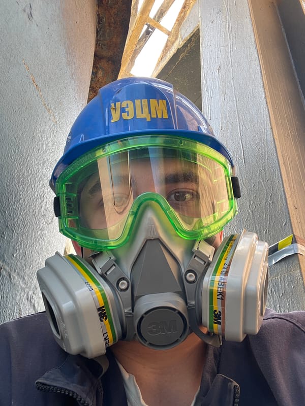 PPE-clad worker at Oskemen industrial facility, July 2026