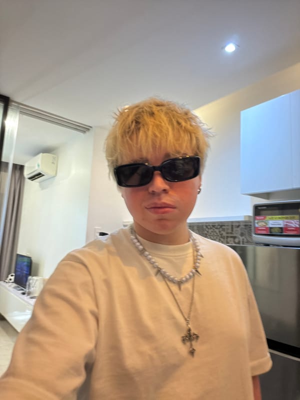 Person takes kitchen selfies with purple phone in Vietnam