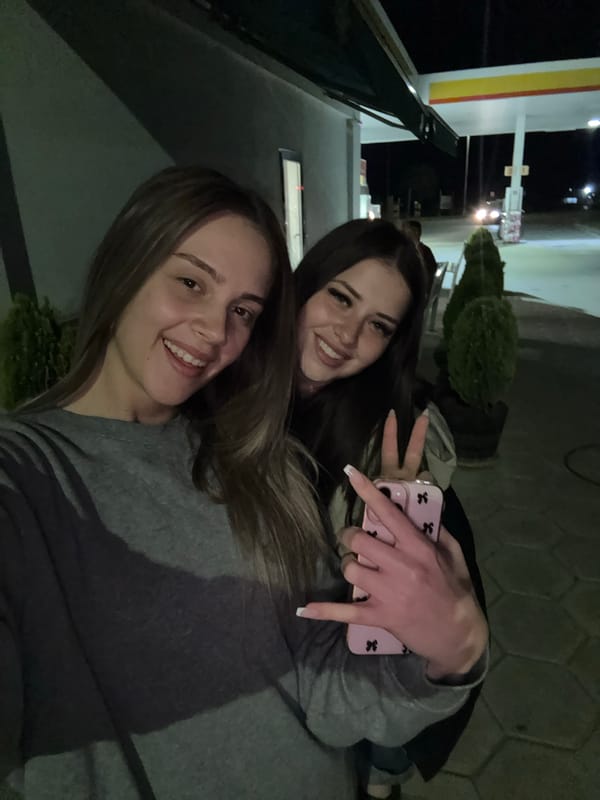 Young Women Take Selfies at Bulgarian Gas Station